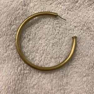 One gold Sheila Fajil hoop
